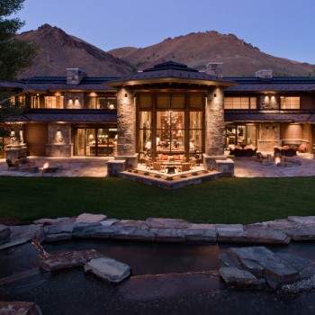 Exterior, horizontal, partial rear facade at twilight with water feature in the foreground, Beyer residence, Ketchum, Idaho; McLaughlin & Associates Architects