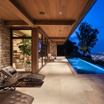 Exterior, horizontal, looking down rear patio toward pool and city view at twilight, Brock Residence, Lookout Mountain, Tennessee; McLaughlin & Associates Architects